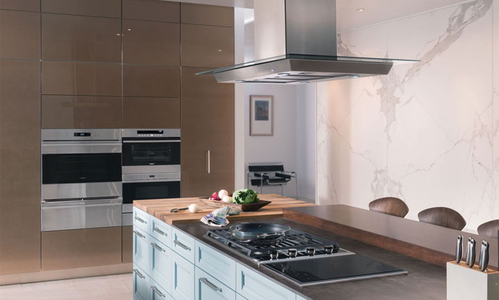 Modern kitchen island stove with built in ovens & warmers
